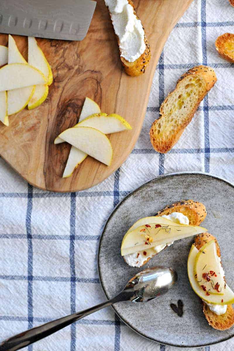 10-Minute Pear + Ricotta Crostini with Honey + Thyme | the pig & quill | #recipe #thanksgiving #appetizer #snack