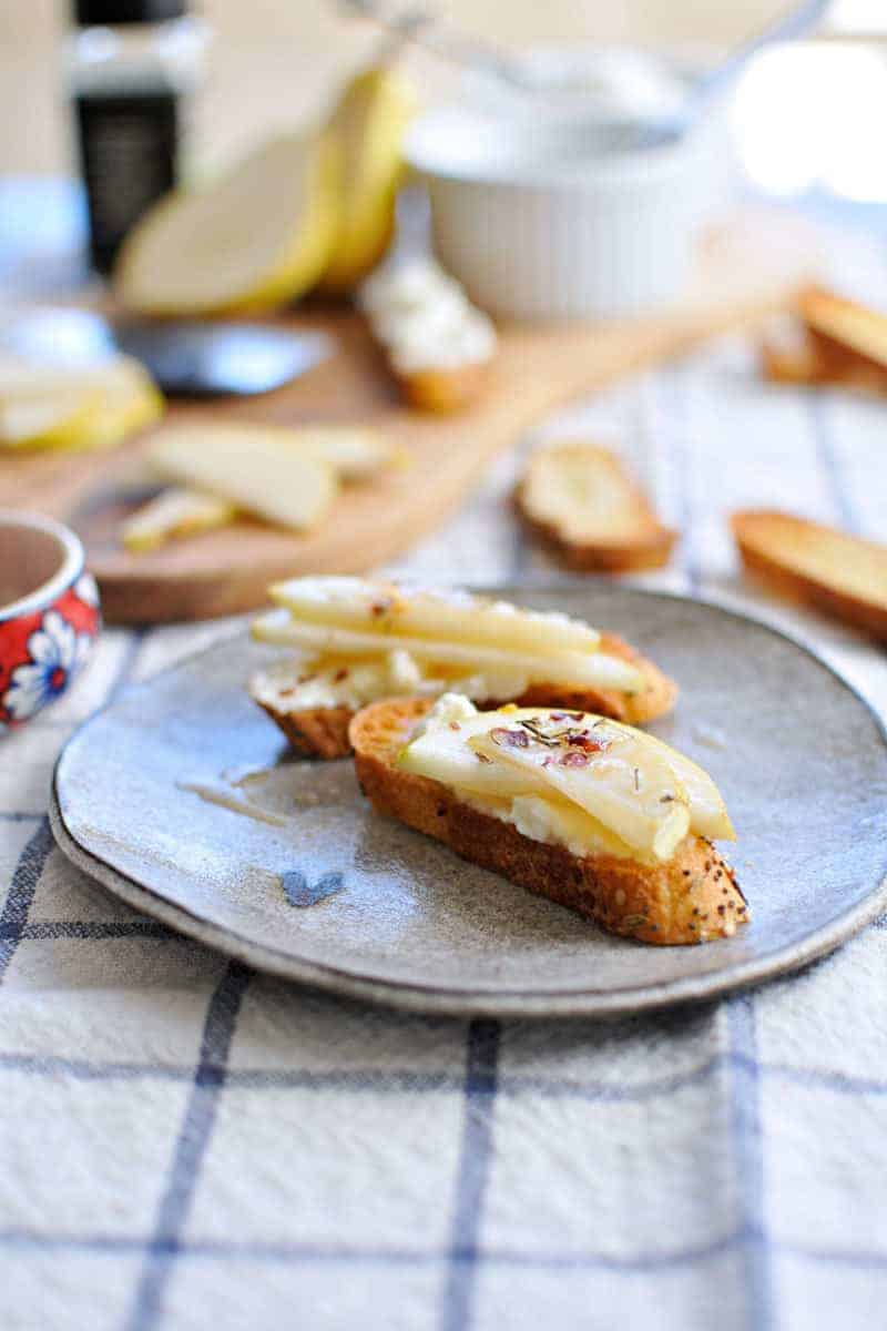 10-Minute Pear + Ricotta Crostini with Honey + Thyme | the pig & quill | #recipe #thanksgiving #appetizer #snack