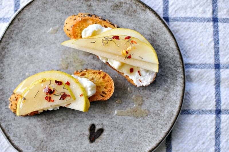 10-Minute Pear + Ricotta Crostini with Honey + Thyme | the pig & quill | #recipe #thanksgiving #appetizer #snack