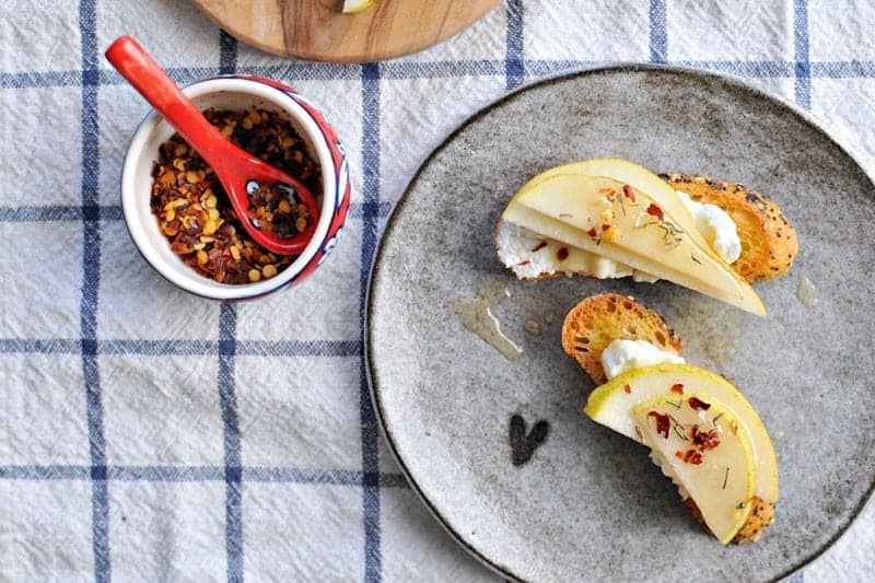 10-Minute Pear + Ricotta Crostini with Honey + Thyme | the pig & quill | #recipe #thanksgiving #appetizer #snack