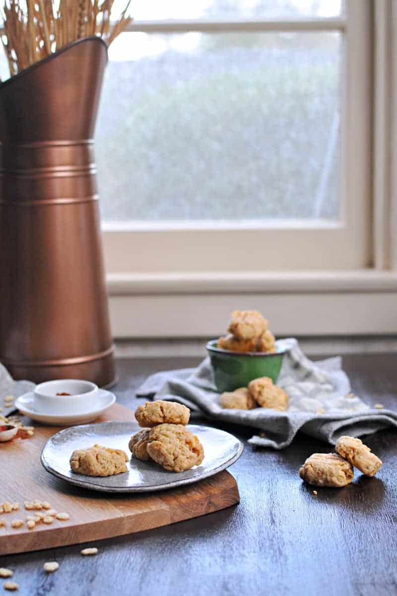 Super simple cheese crisps made with crisped rice cereal!! Great for cheese plates or party trays. Full recipe at www.thepigandquill.com. #partyfood #NYE #recipe #cheese #snacks