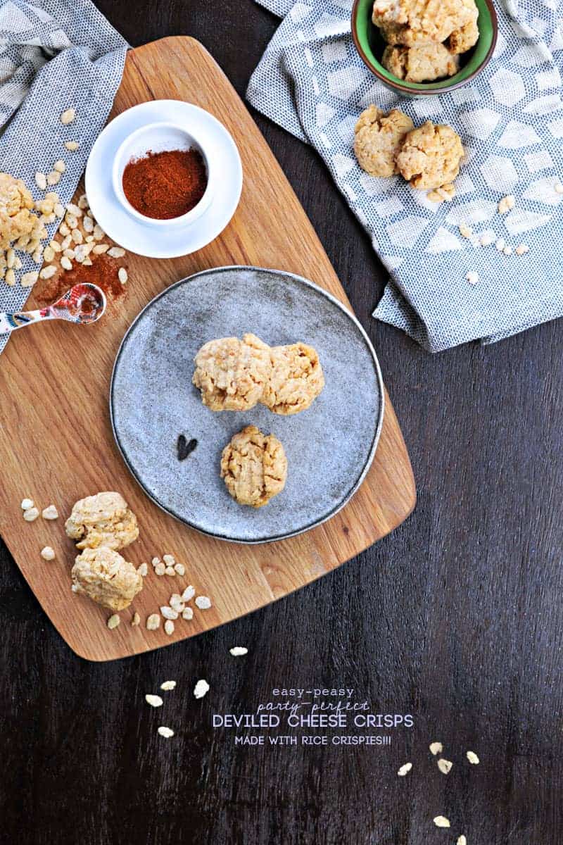 Super simple cheese crisps made with crisped rice cereal!! Great for cheese plates or party trays. Full recipe at www.thepigandquill.com. #partyfood #NYE #recipe #cheese #snacks