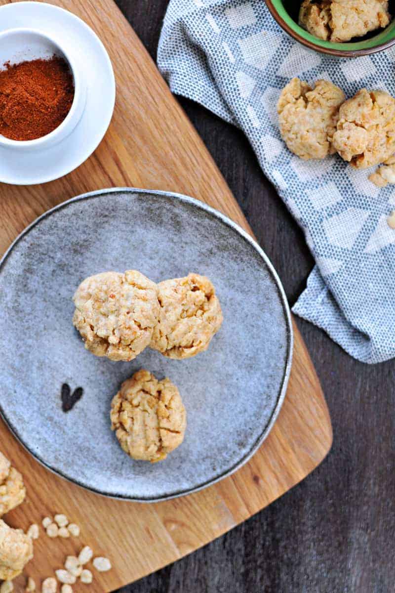 Super simple cheese crisps made with crisped rice cereal!! Great for cheese plates or party trays. Full recipe at www.thepigandquill.com. #partyfood #NYE #recipe #cheese #snacks