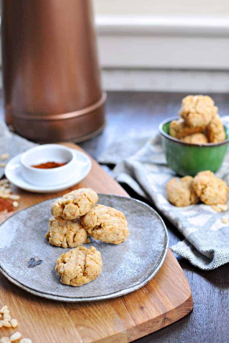 Super simple cheese crisps made with crisped rice cereal!! Great for cheese plates or party trays. Full recipe at www.thepigandquill.com. #partyfood #NYE #recipe #cheese #snacks