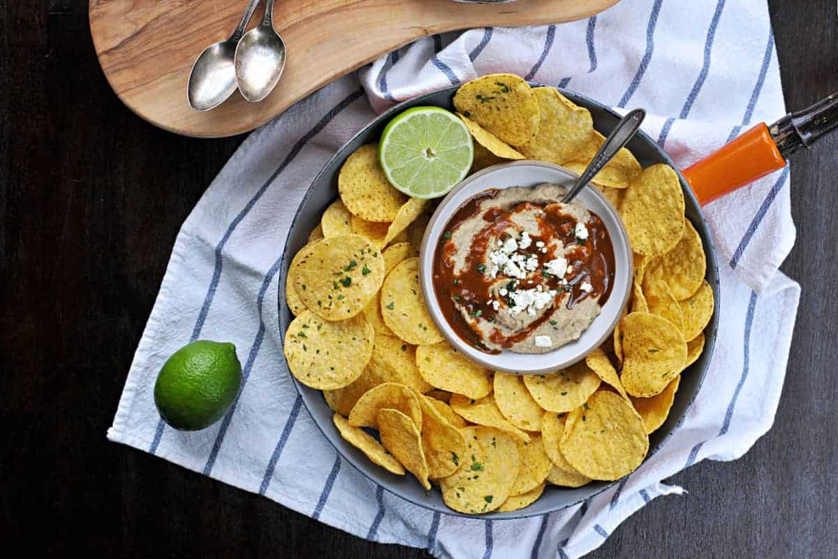 Two recipes in one: toasty, nutty hummus drizzled with a fast and foolproof spicy sauce. Super addicting! Full recipe at www.thepigandquill.com. #vegan #superbowl #snacks #recipe