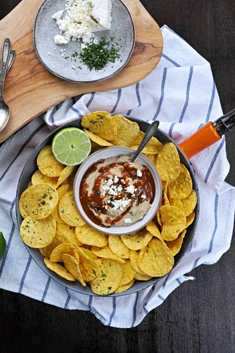 Two recipes in one: toasty, nutty hummus drizzled with a fast and foolproof spicy sauce. Super addicting! Full recipe at www.thepigandquill.com. #vegan #superbowl #snacks #recipe