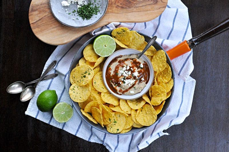 Two recipes in one: toasty, nutty hummus drizzled with a fast and foolproof spicy sauce. Super addicting! Full recipe at www.thepigandquill.com. #vegan #superbowl #snacks #recipe