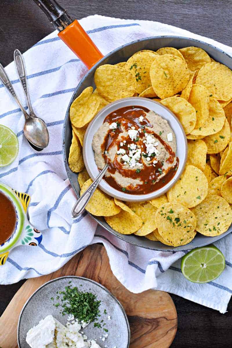 Two recipes in one: toasty, nutty hummus drizzled with a fast and foolproof spicy sauce. Super addicting! Full recipe at www.thepigandquill.com. #vegan #superbowl #snacks #recipe