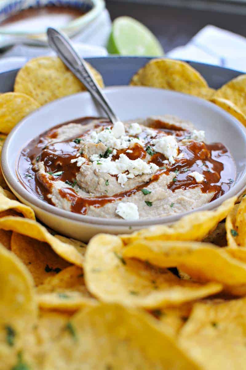 Two recipes in one: toasty, nutty hummus drizzled with a fast and foolproof spicy sauce. Super addicting! Full recipe at www.thepigandquill.com. #vegan #superbowl #snacks #recipe