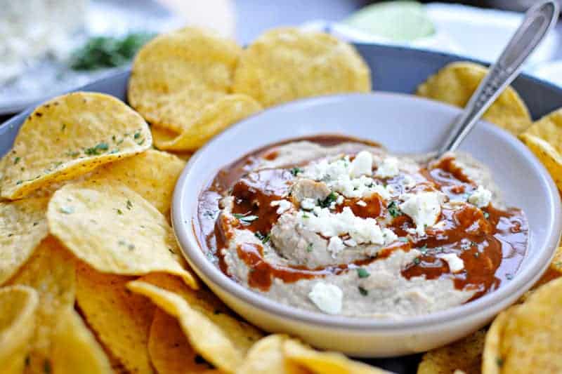 Two recipes in one: toasty, nutty hummus drizzled with a fast and foolproof spicy sauce. Super addicting! Full recipe at www.thepigandquill.com. #vegan #superbowl #snacks #recipe