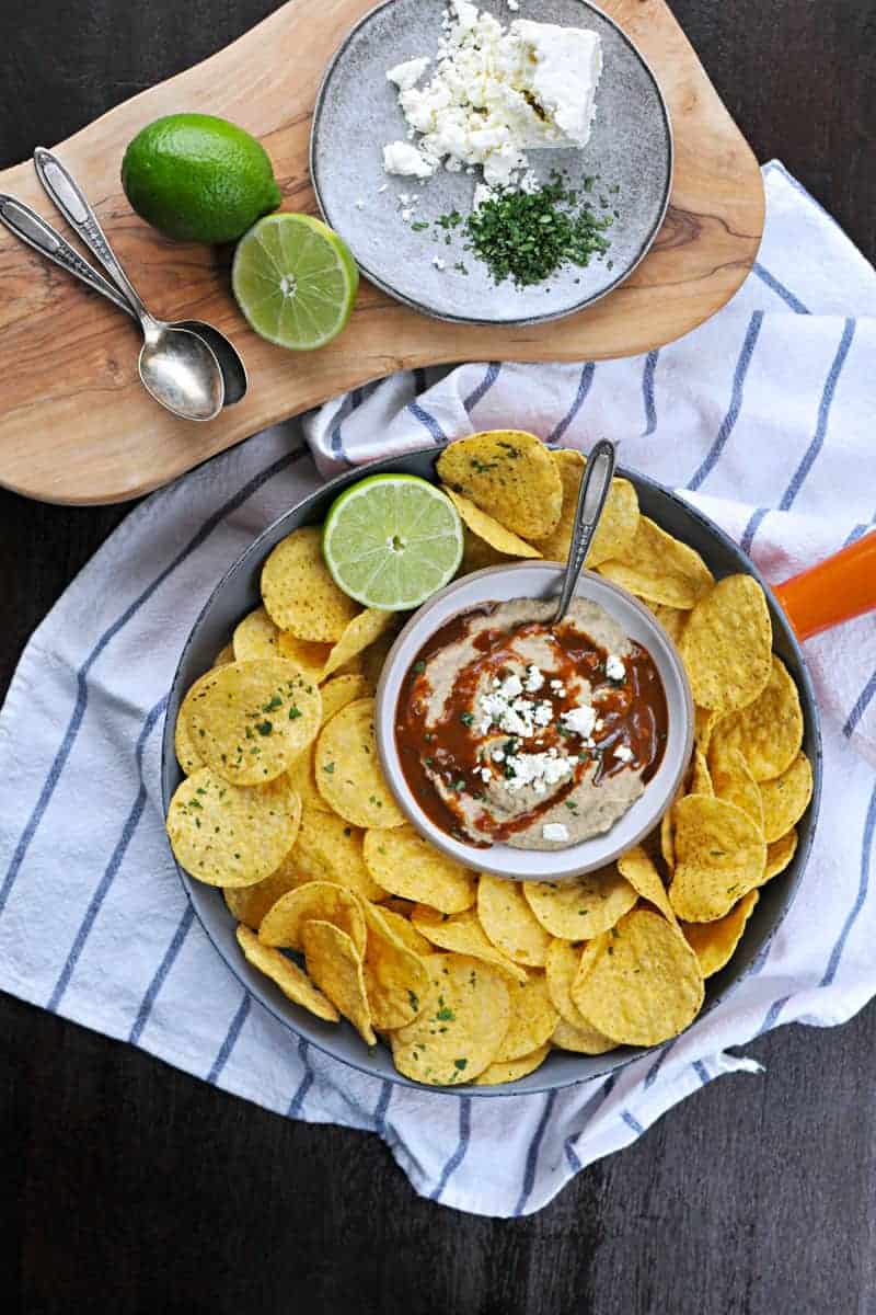 Two recipes in one: toasty, nutty hummus drizzled with a fast and foolproof spicy sauce. Super addicting! Full recipe at www.thepigandquill.com. #vegan #superbowl #snacks #recipe