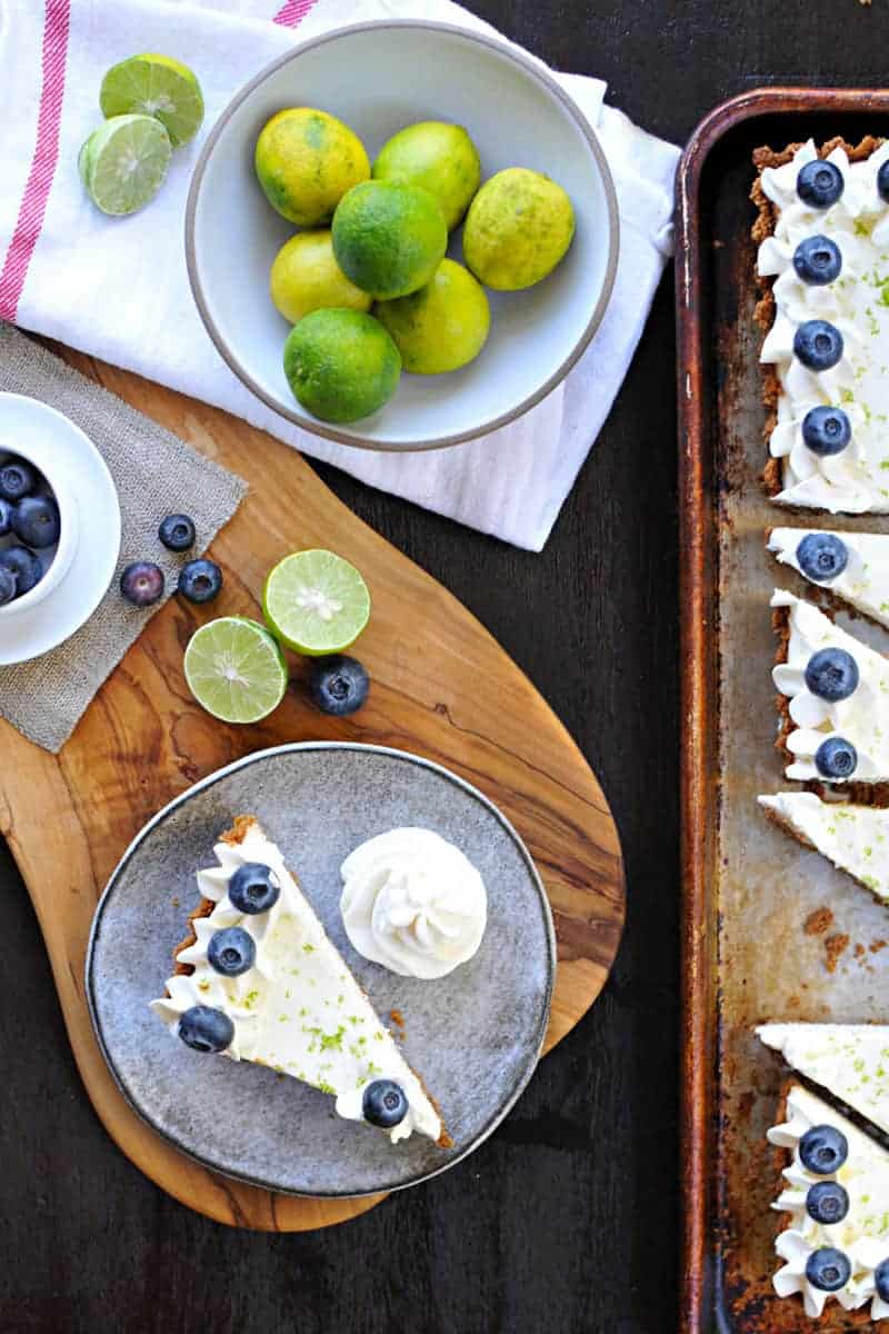 blueberry key lime cheesecake tart with gingersnap crust recipe via thepigandquill.com | #baking #sweets #dessert #summer