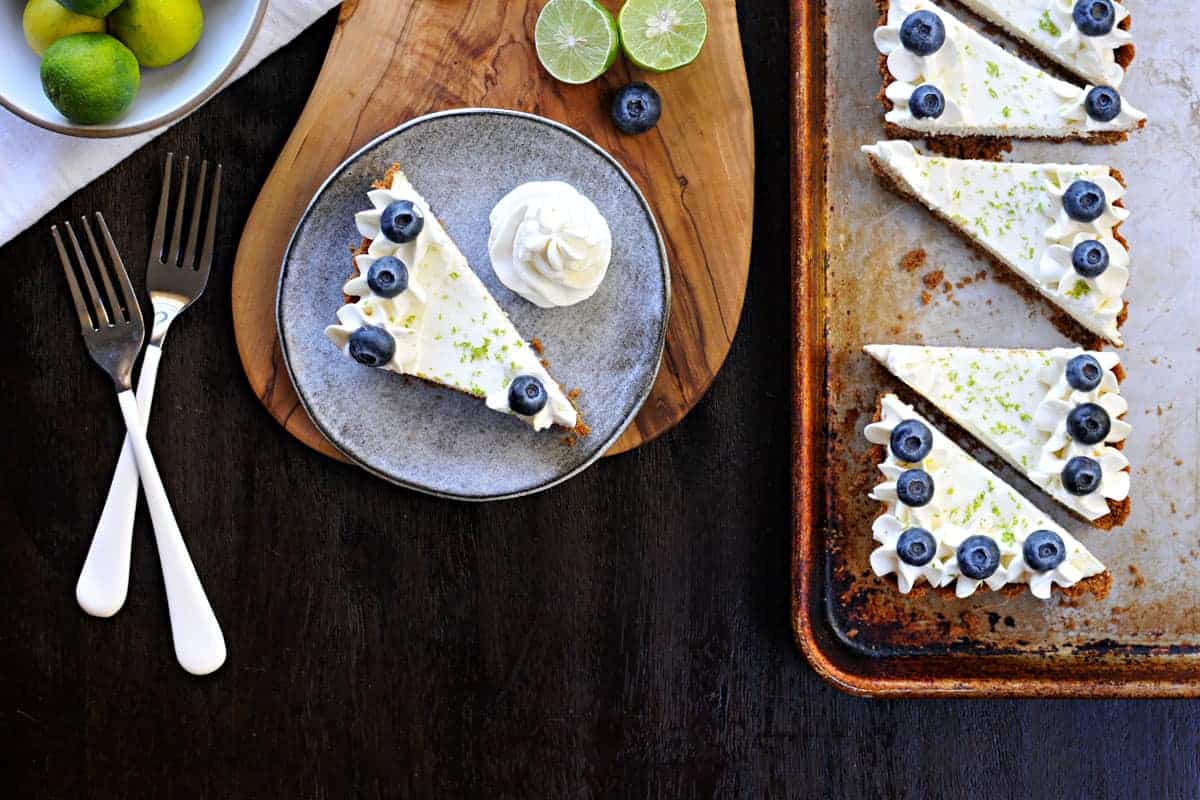 blueberry key lime cheesecake tart with gingersnap crust recipe via thepigandquill.com | #baking #sweets #dessert #summer