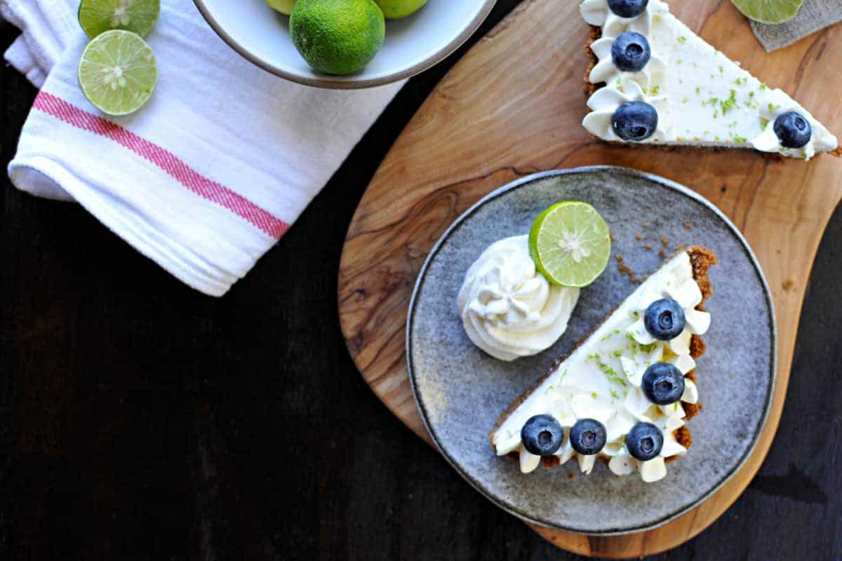 blueberry key lime cheesecake tart with gingersnap crust recipe via thepigandquill.com | #baking #sweets #dessert #summer