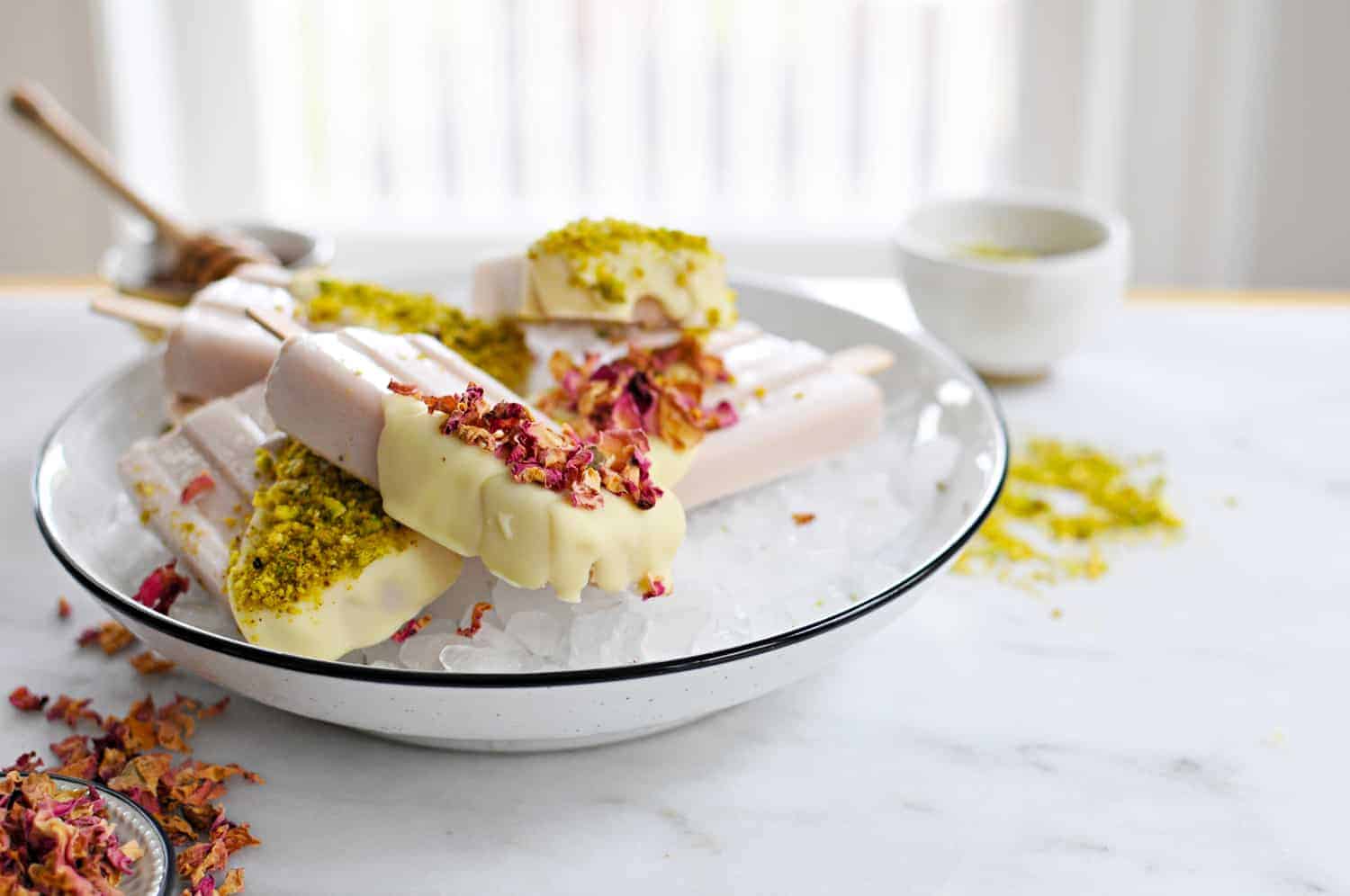 White Chocolate Dipped Rose Milk Popsicles recipe (via thepigandquill.com) #summer #dessert #pistachios