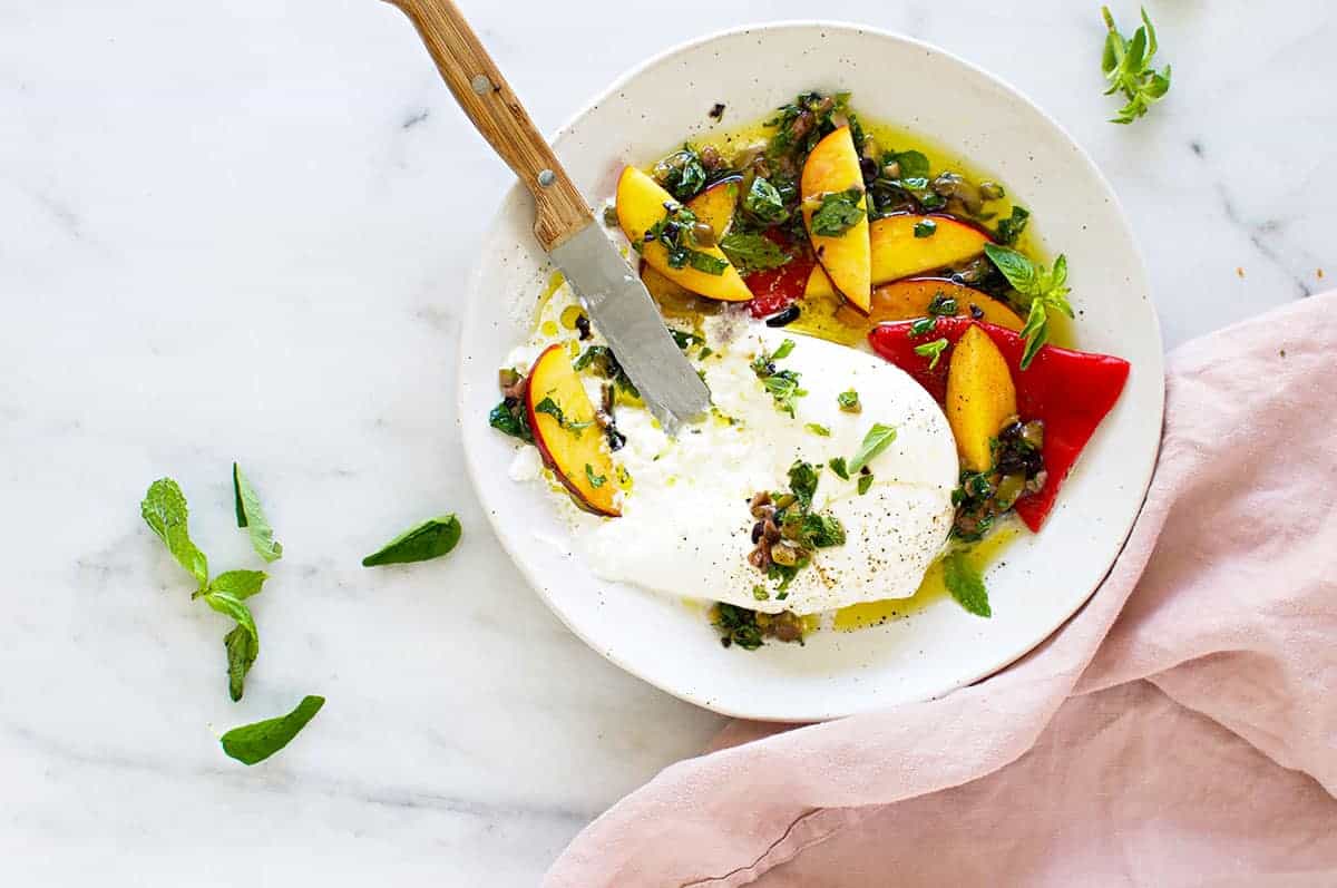 Burrata Appetizer with Mediterranean Honey Herb Oil, Nectarines + Roasted Peppers recipe (via thepigandquill.com)